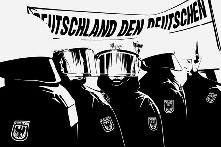 Polizisten vor einem Transparent mit der Aufschrift "Deutschland den Deutschen"