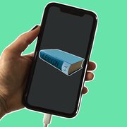 Ein Smartphone. Auf dem Display ist die Illustration eines Buches zu sehen. 