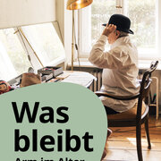 Eine Frau sitzt an einem Tisch und setzt sich einen Hut auf. 