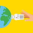 Eine Hand dreht am Temperaturregler an der Erde