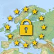 DSGVO-Konzept mit Schloss und EU-Sternen auf einer Europakarte.